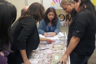 Lina Velasco, a planner for the city, listens to the proposed changes that residents had on the area of Cutting Boulevard. (Photo by: Stephen Hobbs)